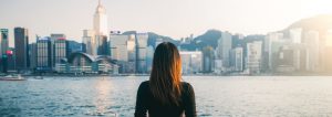 Young woman overlooking Hong Kong Victoria Harbour