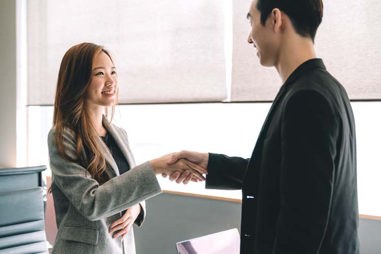 hr office workers shaking hands