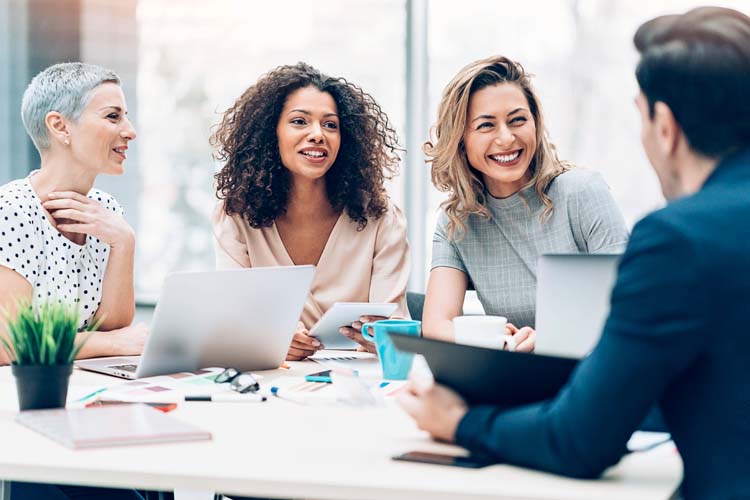 Multi-ethnic group of business persons talking in the office