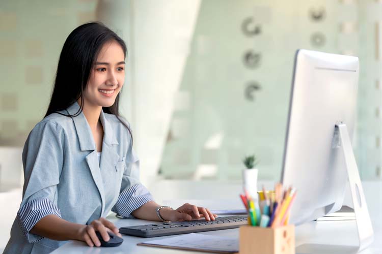 Marketer working with computer in the office.