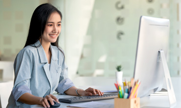 Marketer working with computer in the office.