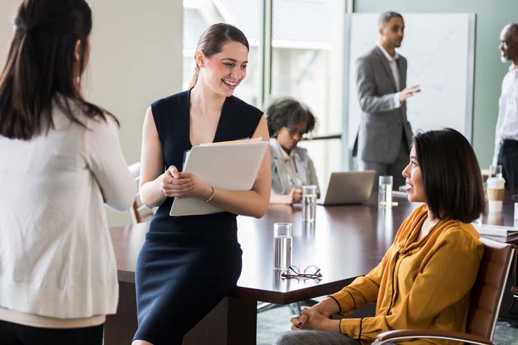 Businesswoman listening to colleague's ideas.