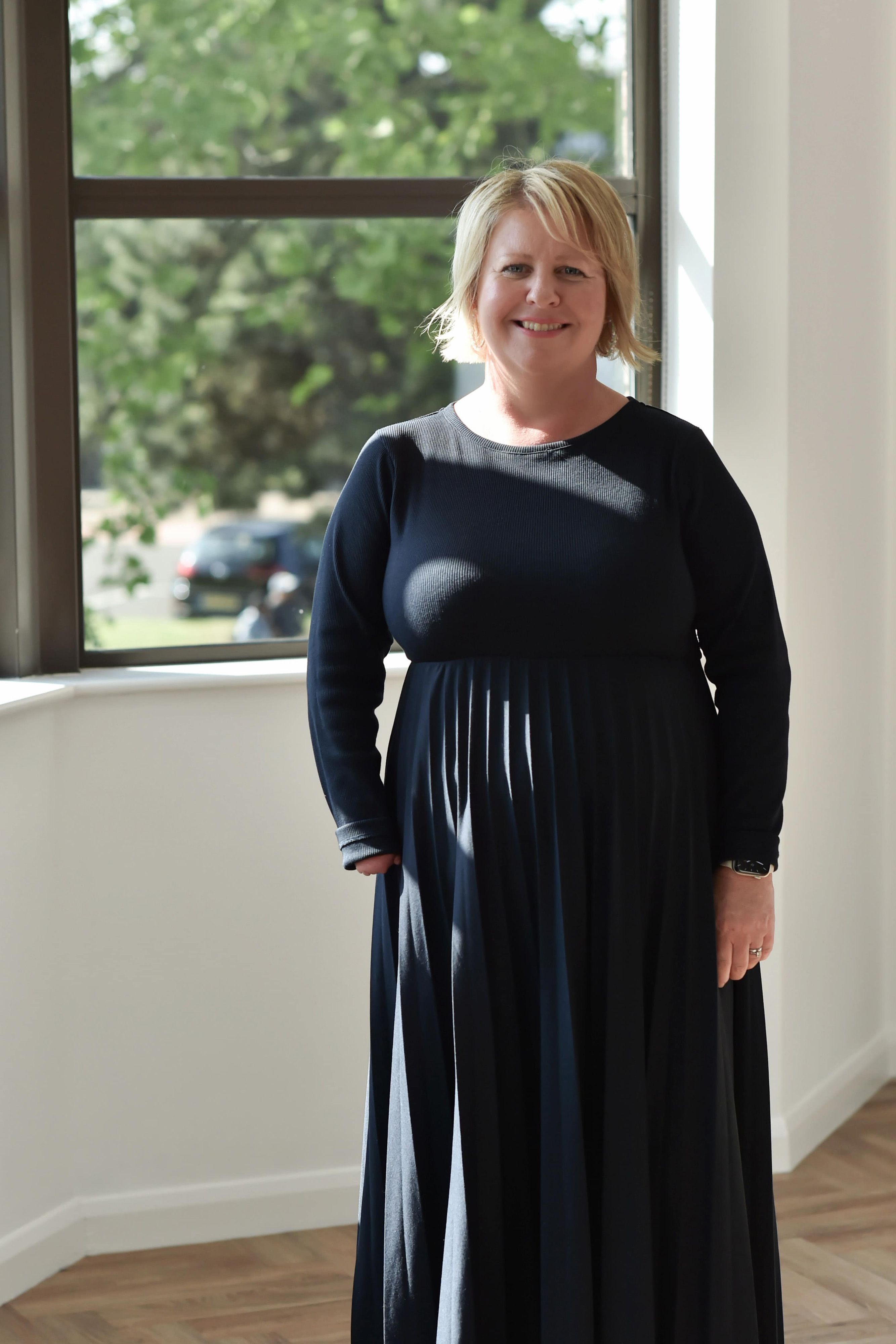 Leanne Cahill standing in front of the window