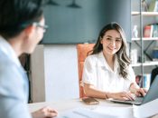 2 Asian Chinese white collar worker brainstorming in meeting room.