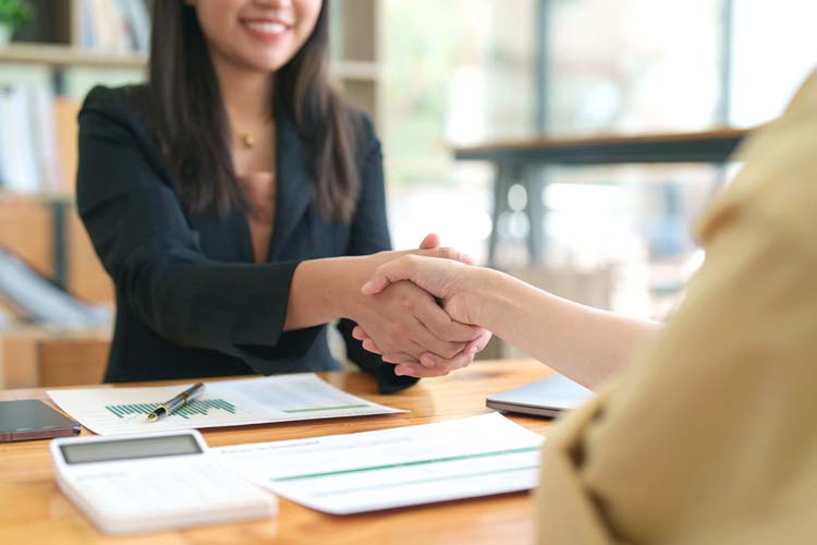 Successful businessmen handshaking after a good deal.