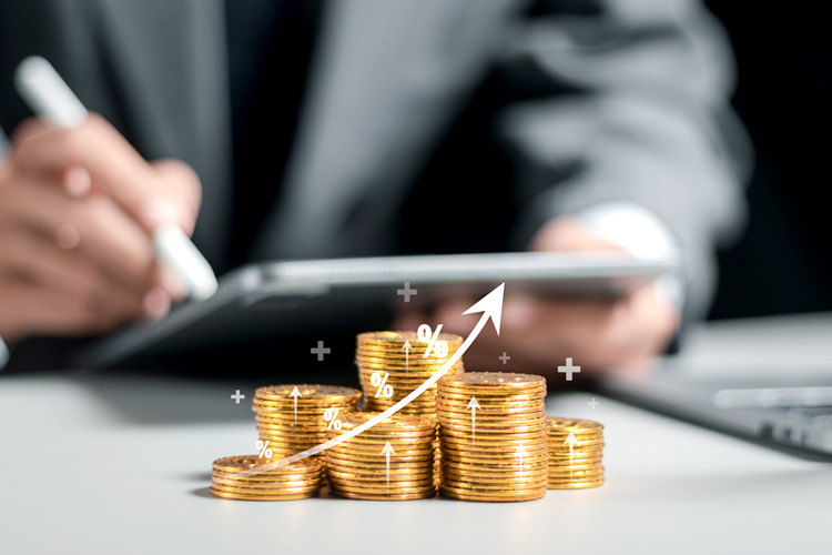 Businessman collecting coins, managing growth and monitoring financial statistics.