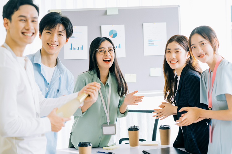 Staff members are seen smiling as they work within a positive work culture.