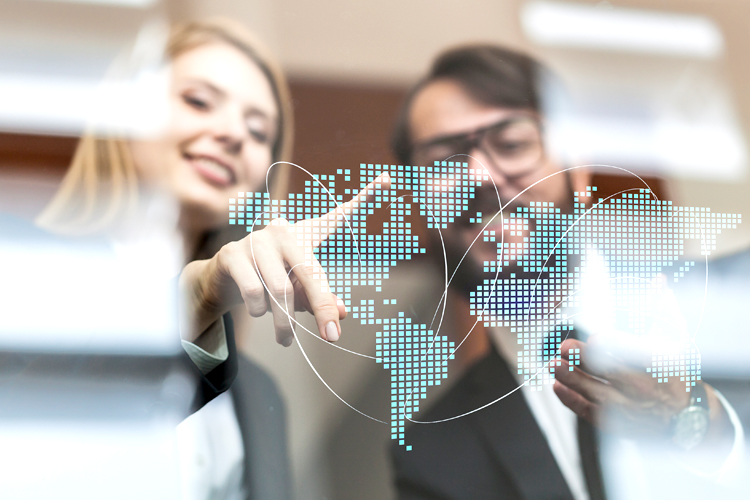 A woman pointing at geometric network polygon world map hologram.