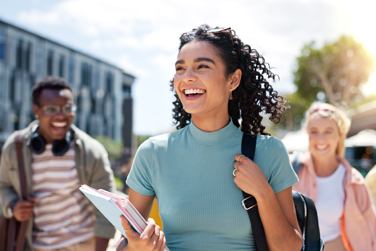 Happy girl with friends at university for learning, bonding and talking with fun.